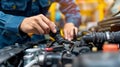 Professional mechanic s hands repairing a vehicle in an automotive repair service workshop