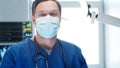 Professional medical doctor working in emergency medicine. Portrait of the surgeon in protective mask. Royalty Free Stock Photo