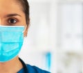 Professional medical doctor working in hospital office, Portrait of young and attractive female physician in protective Royalty Free Stock Photo