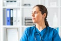 Professional medical doctor working in hospital office, Portrait of young and attractive female physician in protective Royalty Free Stock Photo