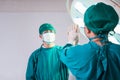 Professional medical doctors performing surgery. Doctors team giving high five, Success and Teamwork concepts Royalty Free Stock Photo