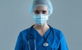 Professional medical worker in protection suit. Nurse, surgeon, doctor or paramedic in blue uniform. Emergency medicine