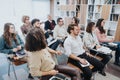 Multiracial, different aged group of businesspeople attending a workshop in modern office. Royalty Free Stock Photo