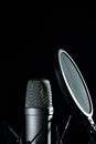 Professional microphone against black background in studio Royalty Free Stock Photo