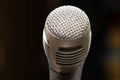 Professional microphone in a music studio on a black background. Record sounds and songs. Chrome metal microphone. Digital Royalty Free Stock Photo