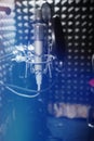 Professional microphone in the recording studio. Musical Concept. Microphone on stage.