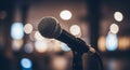 Title: Professional Microphone On Stage With Blurred Lights Background, Music Performance Concept Royalty Free Stock Photo