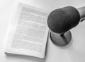 Professional microphone and text on sheets of paper Royalty Free Stock Photo