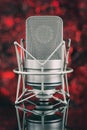 Professional microphone in unfocused background. Mic Royalty Free Stock Photo