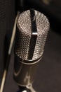 Professional microphone white metallic in recording studio