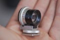 Professional Mini macro camera lens in the hand