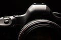 Professional modern DSLR camera low key image