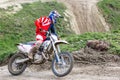 Professional Motocross Motorcycle Rider Drives Over the Road Track.