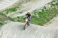 Professional Motocross Motorcycle Rider Drives Over the Road Track. Royalty Free Stock Photo