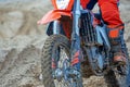 Professional Motocross Motorcycle Rider Drives Over the Road Track. clouse up Royalty Free Stock Photo