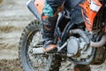 Professional Motocross Motorcycle Rider Drives Over the Road Track. Close up croped shot Royalty Free Stock Photo