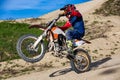 Professional Motocross Motorcycle Rider Drives Over the Road Track.