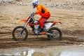 Professional Motocross Motorcycle Rider Drives Over the Road Track.