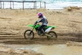 Professional Motocross Motorcycle Rider Drives Over the Road Track.