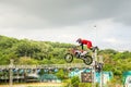 A professional motorcycle rider giving a free style motorcross acrobatics demonstration in Shenzhen Zoo park, in China