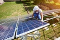 Professional mounter installing innovative solar panels.
