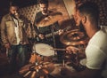 Professional music band performing in boutique recording studio Royalty Free Stock Photo