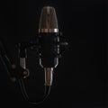 The professional music microphone in sound recording studio isolated on black background. For singers. Musical concept Royalty Free Stock Photo