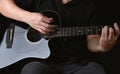 Professional musician playing acoustic guitar in music recording Royalty Free Stock Photo