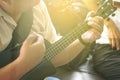 Professional Musician Playing Modern Ukulele Guitar in the Party