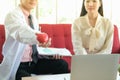 Professional nutritionist asian man consulting asia woman in clinic or hospital or medical club Royalty Free Stock Photo