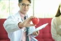 Professional nutritionist asian man consulting asia woman in clinic or hospital or medical club Royalty Free Stock Photo