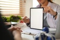Professional nutritionist showing digital tablet and giving consultation to patient in clinic Royalty Free Stock Photo