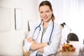 Professional nutritionist with stethoscope in office