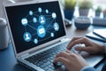 Person using laptop with email network connectivity on a computer screen in office setting Royalty Free Stock Photo