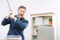 Professional office worker holding sword