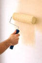 Professional Paint Roller Applying Warm Beige Color For Modern Interior Wall Design Royalty Free Stock Photo