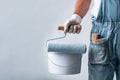 Professional Painter Holding Roller and Paint Bucket Royalty Free Stock Photo