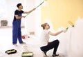 Professional painters working together indoors