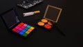 Professional pallet of eyeshadow. Multicoloured eye shadows. Black luxury background. Copy Space