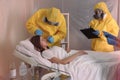 Professional paramedics examining patient with virus in quarantine