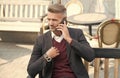 Professional person in formal style talk on modern phone mobile device resting in outdoor cafe, smartphone