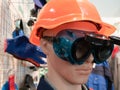 Professional personal protective safety engineering equipment for workers - dummy in orange helmet and plastic glasses