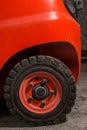 Professional photo of a red forklift wheel