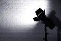 Professional photo studio lighting equipment near brick wall Royalty Free Stock Photo