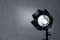 Professional photo studio lighting equipment near brick wall. Royalty Free Stock Photo