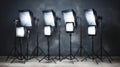 Professional photo studio setup with cameras, tripods, lighting, softboxes, and backdrops