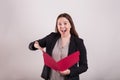 Buisness women holding open red folder excited expression Royalty Free Stock Photo