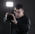 Professional photographer with a camera.isolated on black background Royalty Free Stock Photo