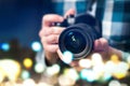 Professional photographer with camera. Man taking photos. Royalty Free Stock Photo