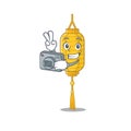 A professional Photographer lamp hanging cartoon character with a camera